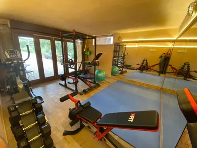a gym with several exercise equipment in a room at ARIALKiS - ΑΡΙΑΛΚίΣ in Plataniás