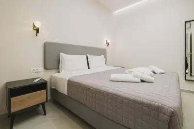 a bedroom with a bed with two towels on it at Peris 1 - Central Apt near Old Town with Parking in Chania Town