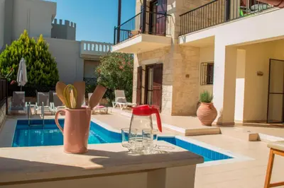 a house with a pool and a table with a vase at Villa Darmarohori Homeleader in Darmarochori