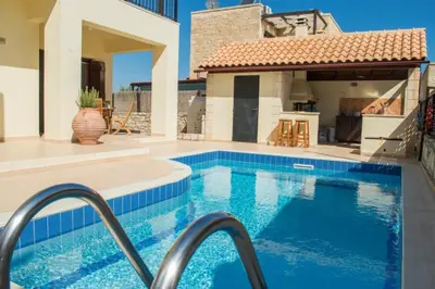 a swimming pool in the backyard of a house at Villa Darmarohori Homeleader in Darmarochori