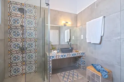 a bathroom with a shower and a sink at FantaSea Luxury Suite in Khóra Sfakíon