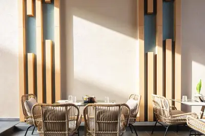 a dining room with a table and chairs at Sapphire Horizon Suites in Kissamos