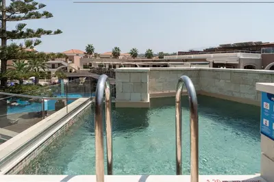 a view of a swimming pool in a resort at Caldera Creta Paradise in Plataniás