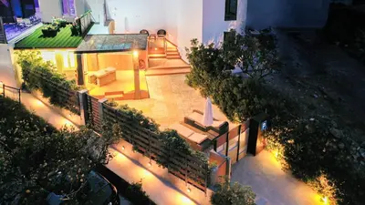 an aerial view of a house with lights at CAVE Luxury House in Kissamos