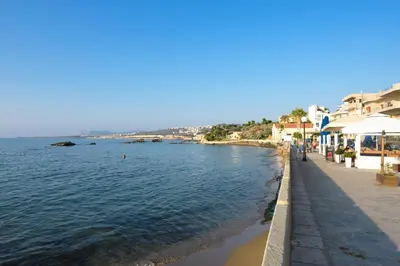 a view of a body of water with buildings at Just For Two in Chania Town