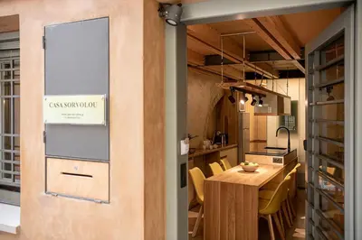 a kitchen and dining room with a table and chairs at Casa Sorvolou in Chania Town