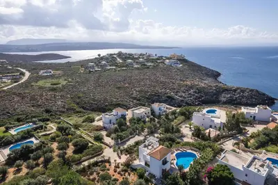 an aerial view of an island with houses and the ocean at Villa Aliki ,Aegean Sea Breeze 750m from the Beach! in Chania Town