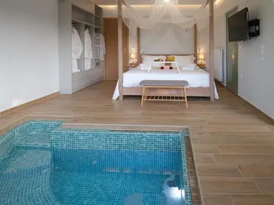 a bedroom with a bed and a swimming pool at Villa Belle Helene Kalamaki Chania in Kalamaki Chanion