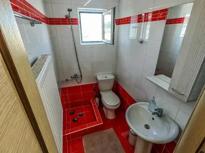 a small bathroom with a toilet and a sink at Nikis Apartment 2 in Chania Town