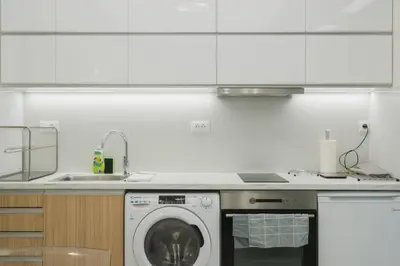 a kitchen with a washing machine and a sink at Peris 3 - Central Apt near Old Town - AC, Wifi in Chania Town