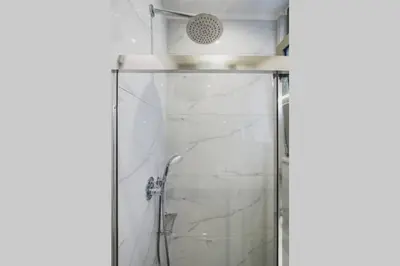 a shower with a glass door in a bathroom at Peris 3 - Central Apt near Old Town - AC, Wifi in Chania Town
