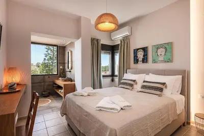 a bedroom with a bed with two towels on it at Artemisia Residence in Chania Town
