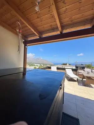 a pool on the roof of a house at Villa Styliani in Kissamos