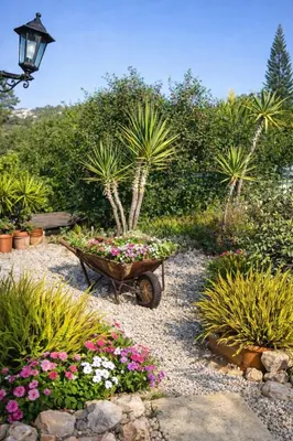 a garden with a wheelbarrow filled with flowers and plants at dream tiny house & luxury tent, 6 km from center Chania in Chania Town