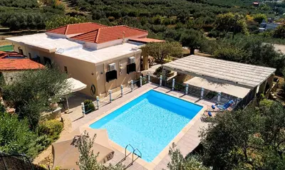 an aerial view of a house with a swimming pool at Cretan Kera Villa Heated Pool in Kerá