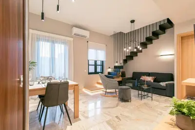 a living room with a couch and a table at House 8 - In the Heart of Venetian town w. Parking in Chania Town