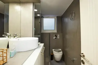 a bathroom with a sink and a toilet at Chrissula apt Homeleader in Chania Town
