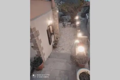 an overhead view of a stone walkway with lights at Georgia's Village House in Kaláthenai
