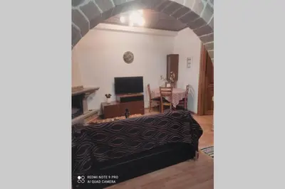 a living room with a couch and a table at Georgia's Village House in Kaláthenai