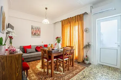 a living room with a table and a couch at Katerina's Apartment in Chania Center in Chania Town