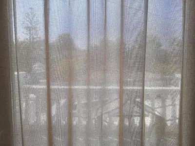 a view of a window with a curtain at Olivia in Chania Town