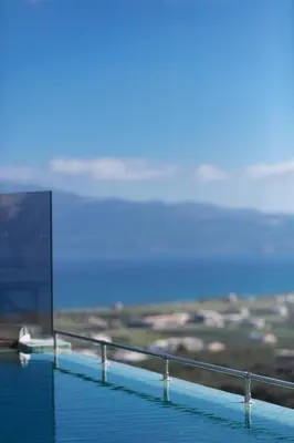 a view of the ocean from the edge of a building at Argyrie Villas, luxury, amazing sea view, heated pool in Kalleryianá