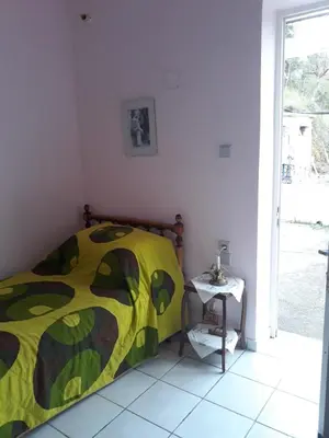 a bedroom with a bed and a side table at Angel Villa in Strovlés