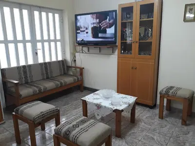 a living room with a couch and a tv at Angel Villa in Strovlés