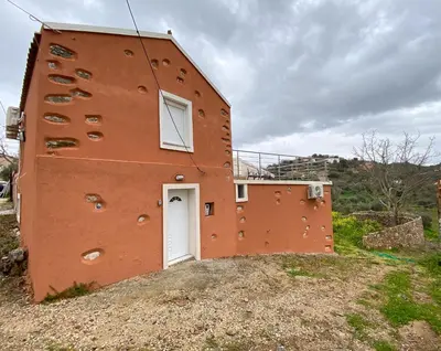 a building with a white door on the side of it at Pulchra Campis,Private Pool,Wifi,Parking in Nerokoúros