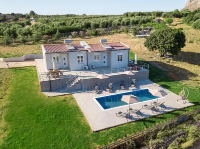 an aerial view of a house with a swimming pool at RODOU Suites & Villas in Chania Town