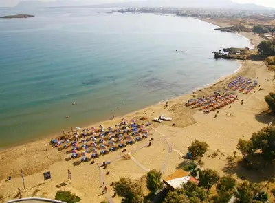 an aerial view of a beach with umbrellas at Lili Apartments,oasis 2,5 km from Hania center in Parigoría