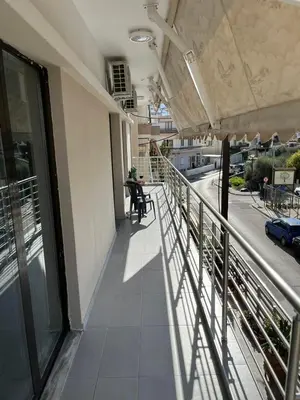 a balcony of a building with a view of a street at GS Lumen Apartment in Chania Town