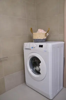 a washing machine with a basket on top of it at VAMA APARTMENT in Plataniás