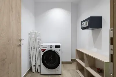 a washer and dryer in a laundry room at Iniada Villas in Chania Town