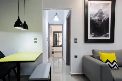 a living room with a couch and a table at Villagio House in Falasarna