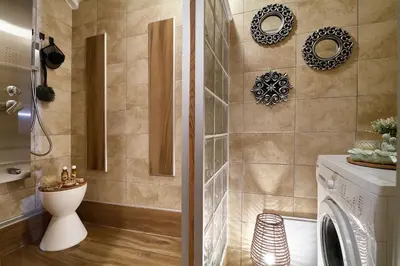 a bathroom with a shower and a washing machine at Dreamscape Residences - Stavros Apartment in Chania Town