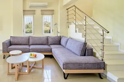 a living room with a couch and a table at Villa Moma in Palio Gerani