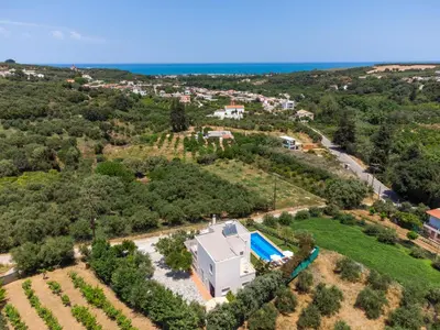 an aerial view of a house with a swimming pool at Villa Moma in Palio Gerani