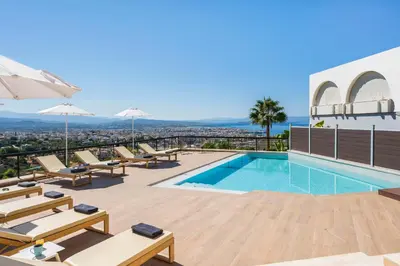 a villa with a swimming pool and views of the city at Villa City View - Heated Pool & Gym - Majestic views - 5 min drive from center in Chania Town