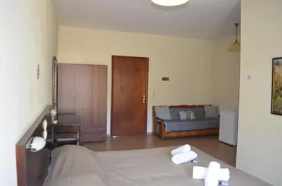 a bedroom with a bed with towels on it at Xenonas Anopolis 2 in Anopoli Sfakion