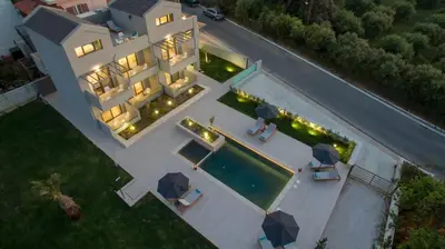 an aerial view of a house with a swimming pool at Eleanthi Modern Living in Galatás