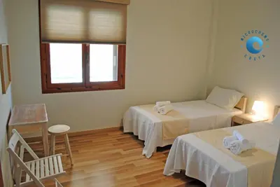 a room with two beds and a window at Villa Anastasia in Kalamaki Chanion