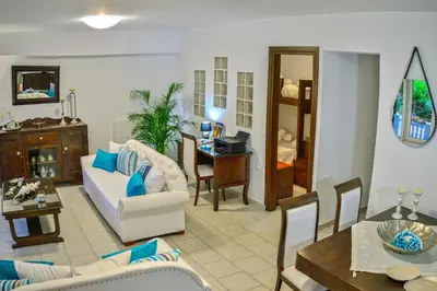 a living room with a couch and a table at *Haritos traditional Apt-5min from Falassarna Bch* in Kissamos