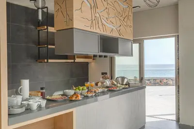 a kitchen with a counter with food on it at panorama new generation in Sfakiá
