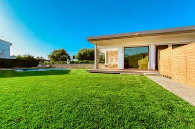 a house with a large yard at Chania Oasis with heated pool in Chania Town