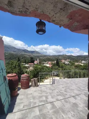 a view from the roof of a building with mountains in the background at Rocky Mountain Villa in Ramní