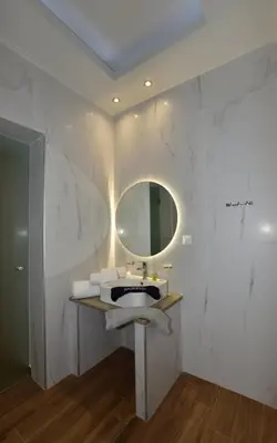 a bathroom with a sink and a mirror at Gonis Grand Luxury Suite in Palaiochóra