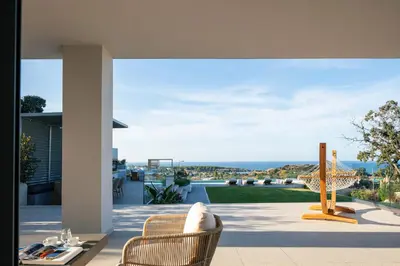 a patio with a view of the ocean from a house at Centro Golden View Villa in Chania Town