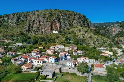 a village in front of a mountain at Villa Erontas -Private heated jacuzzi and mini pool in Makhairoí