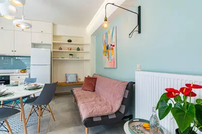 a living room with a couch and a table at Olga's Organic garden Home for a couple! with Wifi & AC in Chania Town